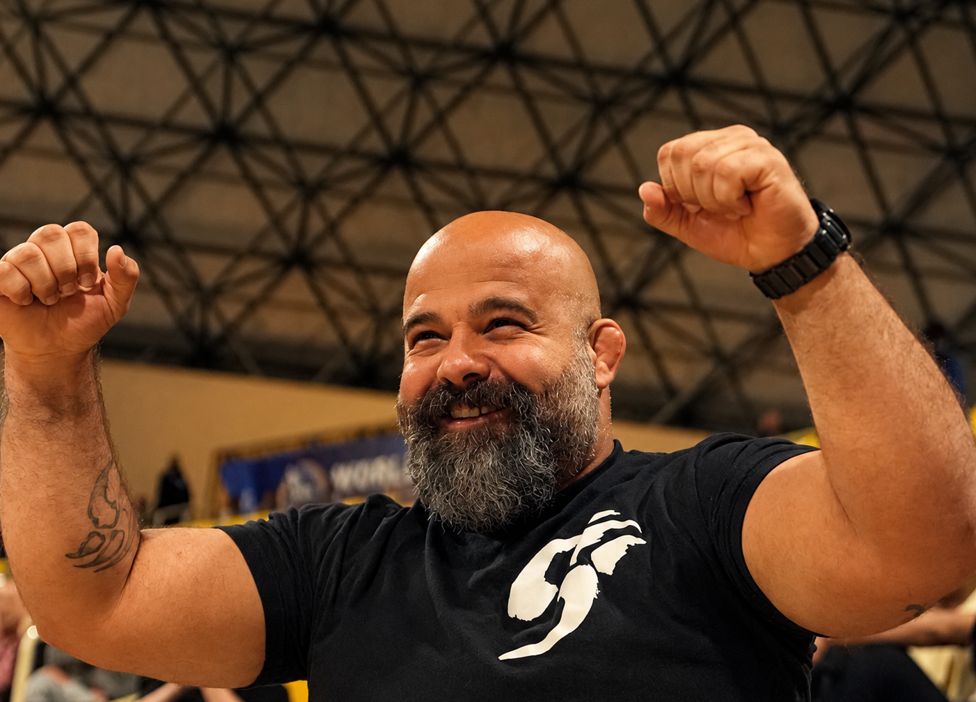 Professor Bruno “Tank” Mendes celebrating at a martial arts event